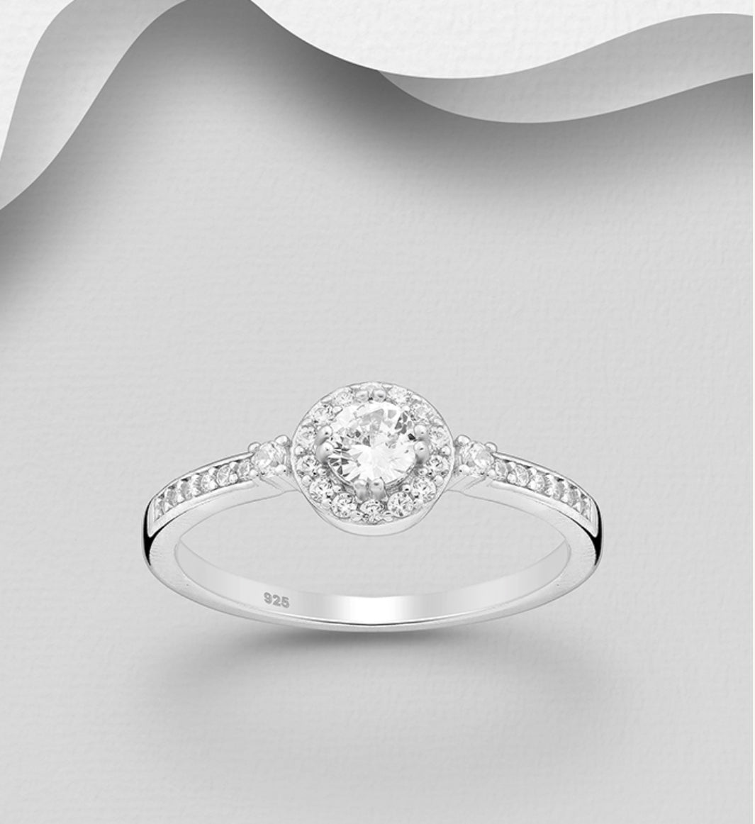 Sterling Silver Halo Ring decorated with CZ Simulated Diamonds